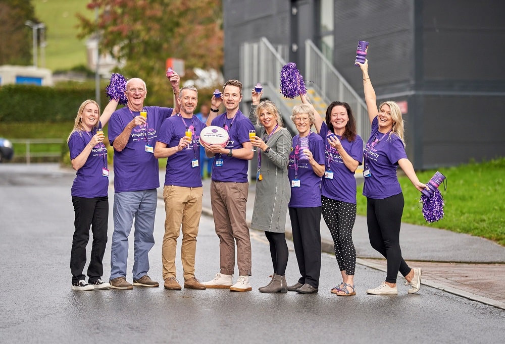 Charity and hospital staff and volunteers celebrate the launch of Royal Devon Hospitals Charity