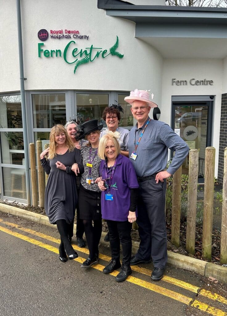 Fern Centre manager Tara Jones and staff and volunteers with some of the items donated for the centre’s wedding sale event on April 11.