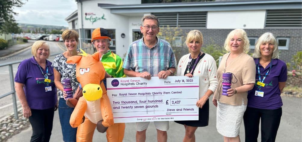 Steve Warner (centre) and Lionel Murphy present the race night fundraising cheque to Fern Centre manager Tara Jones, with partners Lucy and Kate and centre volunteers Tina Wilby and Jen Foster