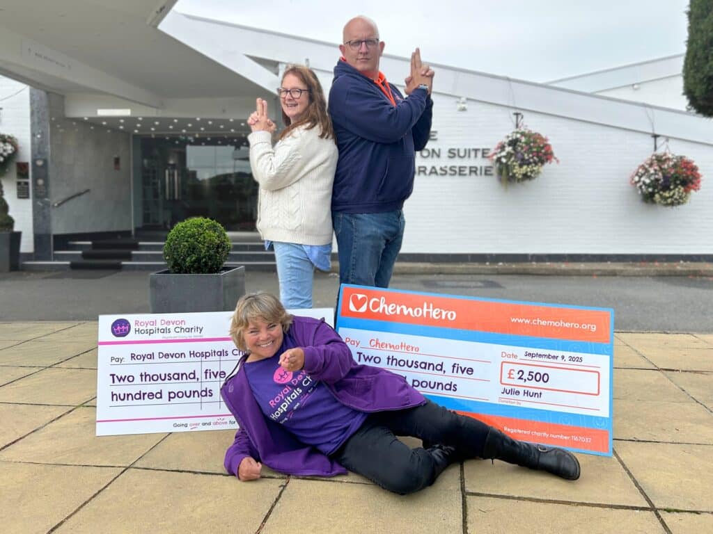 Councillor Julie Hunt presents the money raised at the Casino Royale Gala to Rob Wallis from ChemoHero and Julie Whitton from Royal Devon Hospitals Charity. Picture: Royal Devon Hospitals Charity