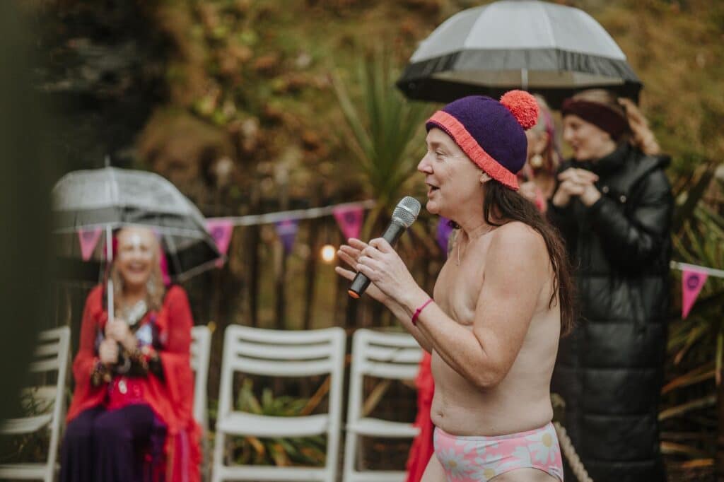 Louise Butcher talking to participants at Topless Swim 2025. Picture by Charlotte Turnbull Photography