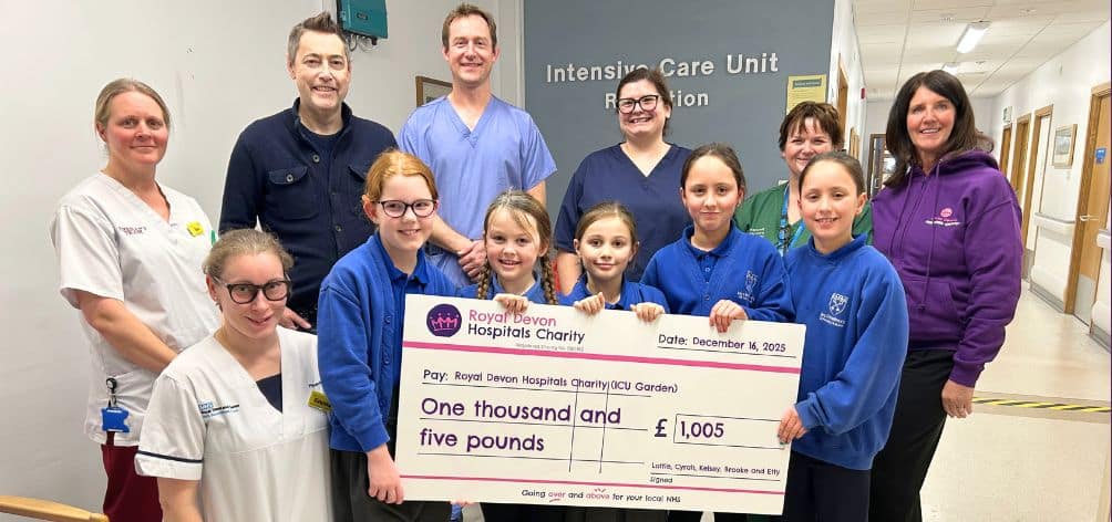 Lottie and friends Cyrah, Kelsey, Brooke and Etty, pictured with Lottie’s dad Matt and Debbie Allen from Royal Devon Hospitals Charity, present their fundraising cheque to ICU staff. Picture: Royal Devon Hospitals Charity