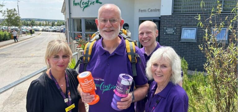 Paul Butler is pictured outside the Fern Centre with staff and volunteers